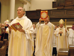 Father Todd Riebe processes into St. Mary Church in Richmond on Jan. 23, 2007, during a celebration of the canonization of St. Theodora Guérin. Father Riebe is the pastor of Holy Family, St. Andrew and St. Mary parishes, all in Richmond. (File photo by Sean Gallagher) 