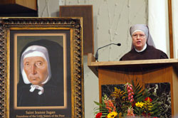 Sister Judith Meredith, superior of the Little Sisters of the Poor at the St. Augustine Home for the Aged in Indianapolis, reads the general intercessions during a Mass of Thanksgiving for the Oct. 11 canonization of St. Jeanne Jugan on Oct. 25 at St. Luke the Evangelist Church in Indianapolis. (Photo by Mary Ann Wyand) 