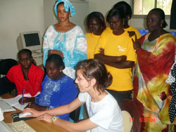 With her hand on a computer mouse, Indianapolis volunteer Anne Lerums provides computer instruction for teachers in a school in the West African country of Senegal. (Submitted photo) 