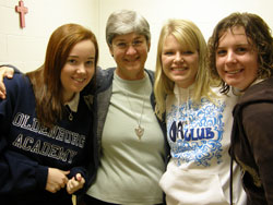 Franciscan Sister Clare Teixeira is a secretary in the guidance office at Oldenburg Academy, a private Catholic high school for about 215 students. She is pictured with some students. (Submitted photo)