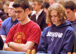 Archdiocesan March for Life pilgrims Chris Slabaugh of Hayden, left, a member of St. Joseph Parish in Jennings County, and Beth Schoettner of Columbus, right, a member of Holy Trinity Parish in Edinburgh, pray during the Mass for Life on Jan. 20 at SS. Peter and Paul Cathedral in Indianapolis before departing for the March for Life in Washington, D.C. (Photo by Mary Ann Wyand)