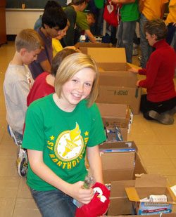 Alexandra Young and her seventh-grade classmates at St. Bartholomew School in Columbus stuff Christmas stockings for American soldiers in Afghanistan. (Submitted photo)