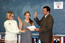 Clark Superior Court Judge Jerome Jacobi swears in Candace Popp, a sophomore at Our Lady of Providence Jr./Sr. High School in Clarksville, during a ceremony for students to adopt a snail in teacher Katie Aebersold’s French class. Holding the Bible is Providence science teacher Ginger Shirley. (Submitted photo)