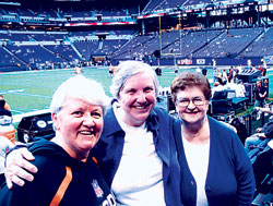 For 25 years, Providence Sister Jean Kenny, left, has predicted the outcome of the Super Bowl. This year, she predicts the Indianapolis Colts will beat the New Orleans Saints. Here she is pictured on Sept. 7, 2008, at Lucas Oil Stadium with two close friends from Indianapolis, Providence Sisters Barbara McClelland, center, and Rita Wade. (File photo)