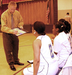 Coach Shane Tyree diagrams a play for members of the girls’ basketball team at Providence Cristo Rey High School in Indianapolis. In its third year in existence, Providence Cristo Rey continues to develop its sports program to give students the experience of learning life lessons from athletics. (Submitted photo)