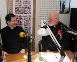 Father Frank Pavone, left, the founder and national director of Priests for Life, based in Staten Island, N.Y., and pastoral director of the Rachel’s Vineyard post-abortion reconciliation ministries, talks with Msgr. Lawrence Moran, a retired diocesan priest, during a pro-life radio program on WHOJ, an Eternal Word Television Network station in Terre Haute, in late January. (Submitted photo)