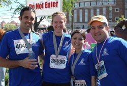 Roger Neal, left, Julie Johnstone, Gabrielle Campo and Anthony Campo, members of the 2008 “Race for Vocations” team, pose for a photo after completing the One America 500 Festival Mini-Marathon in Indianapolis. (Submitted photo)