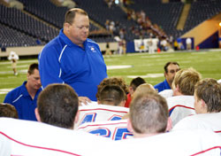 As the coordinator of youth ministry at St. Maurice Parish in Decatur County and chaplain of the North Decatur High School football team, Dave Gehrich is always searching for new ways to bring the message of Christ’s life to teenagers, including football players. Gehrich is pictured here talking to the North Decatur team during their visit to the RCA Dome in Indianapolis for a game in 2007. (Submitted photo)