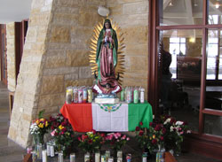 A shrine to Our Lady of Guadalupe stands in the narthex of St. Bartholomew Church in Columbus in December 2005. A task force of parishioners recently studied how the Seymour Deanery parish can better welcome Hispanic immigrants who have recently moved to Columbus. (File photo by Sean Gallagher)