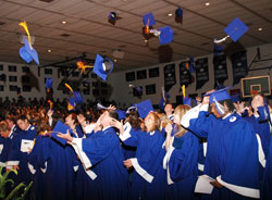 Members of the 2009 graduating class of Bishop Chatard High School in Indianapolis throw their graduation caps into the air during their commencement ceremony on May 31, 2009, at the Indianapolis North Deanery interparochial high school. (Submitted photo)