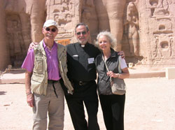 St. Charles Borromeo parishioners Thomas and Joan Rillo of Bloomington and Benedictine Brother Maurus Zoeller of Saint Meinrad Archabbey in St. Meinrad pose for a photograph in front of the famed Abu Simbel in Nubia, Egypt. In 1257 B.C., the pharaoh Ramses II issued an order to have the two temples carved out of solid rock. The temples are among the most magnificent monuments in the world. Their removal and reconstruction on higher ground above the Nile River in 1968 was an historical event. Their interiors feature some of the best-preserved relief carvings and hieroglyphics in Egypt. (Submitted photo)