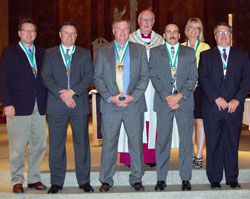The 2010 St. John Bosco Award winners pose for a photograph with Msgr. Joseph F. Schaedel, vicar general, during the Catholic Youth Organization awards ceremony on May 4 at SS. Peter and Paul Cathedral in Indianapolis. They are, from left, front row, Mike Lewinski of St. Mark the Evangelist Parish, Jess Stump of St. Pius X Parish, Clay Courtney of St. Malachy Parish in Brownsburg, Jim Meiner of St. Lawrence Parish, and Tom Dale of St. Barnabas Parish. In the back row, with Msgr. Schaedel, is Joan Bartley of St. Jude Parish. (Submitted photo)