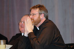 Father Eric Johnson, right, the archdiocesan director of vocations, and Msgr. Frederick Easton, vicar judicial of the archdiocesan Metropolitan Tribunal, enjoy a joke shared by retired Father Joseph Sheets during the Seymour Deanery’s Clergy Appreciation Dinner on June 8 at St. Mary Parish in North Vernon. Father Johnson was the keynote speaker for the dinner sponsored by the Knights of Columbus to honor priests and deacons. (Photo by Mary Ann Wyand)