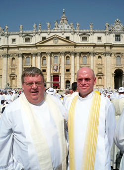 Father Robert Hausladen and Father Robert Robeson stand in St. Peter’s Square in Rome on June 11 prior to Mass at which Pope Benedict XVI was the principal celebrant. They and some 15,000 other priests from 90 countries around the world concelebrated the Mass, which marked the end of the Year for Priests. Father Hausladen is the associate pastor of St. Pius X Parish and chaplain of Bishop Chatard High School, both in Indianapolis. Father Robeson is the rector of Bishop Simon Bruté College Seminary and provides sacramental assistance to St. Anthony and Holy Trinity parishes, all in Indianapolis. (Submitted photo)