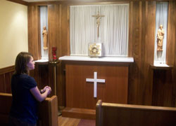 Jennifer Prickel prays in an adoration chapel at Holy Family Parish in Syracuse, N.Y., in June while visiting her twin brother, Andrew, who is a youth minister there. Jennifer recently received a gift of approximately $52,000 to pay off her student loan debt, which will allow her to enter the Steubenville, Ohio-based Sisters of Reparation to the Most Sacred Heart of Jesus in August. (Submitted photo)