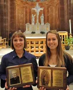St. Joan of Arc parishioner Patricia Yeadon of Indianapolis, left, holds the 2010 Archbishop Edward T. O’Meara Respect Life Award and Cardinal Ritter High School senior Alyssa Barnes, a member of St. Malachy Parish in Brownsburg, displays the 2010 Our Lady of Guadalupe Pro-Life Youth Award following the Respect Life Mass on Oct. 3 at SS. Peter and Paul Cathedral in Indianapolis. (Photo by Mary Ann Wyand)