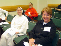 Dominican Sister Maria Fidelis Gray, left, the principal of Our Lady of Mt. Carmel School in Carmel, Ind., and Anne Dumas, the principal of St. Augustine School in Renssselaer, Ind., both in the Lafayette Diocese, gear up for a breakout session for administrators on Oct. 29. (Photo by Mary Banta)