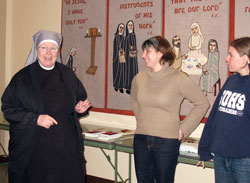 Sister Judith Meredith, a member of the Little Sisters of the Poor, left, speaks with Theresa Mills and Annie Girresch about her religious community on Feb. 27, 2010, at the order’s St. Augustine Home for the Aged in Indianapolis. The visit was part of a “nun run” in which Mills, Girresch and three other women visited members of seven religious communities in Beech Grove and Indianapolis. Another “nun run” will take place on Feb. 18-19. (Submitted photo)