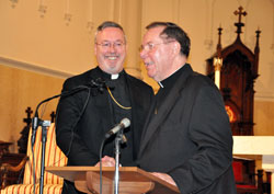 Archbishop Daniel M. Buechlein, right, stands next to Bishop-designate Christopher Coyne, a native of the Archdiocese of Boston, during a January 14 press conference at St. John the Evangelist Church in Indianapolis. Bishop-designate Coyne was named by Pope Benedict XVI as the first auxiliary bishop the archdiocese has had since 1933. (Photo by Sean Gallagher)