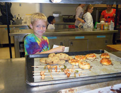 Clayton Phillip’s smile shows how much fun the second-grade student at St. Mary’s Catholic Academy in New Albany had during a Cooking with Math class, part of an innovative program at the school called Intensive Days. (Submitted photo)