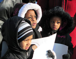From left, Holy Angel Catholic School pre-kindergarten students Keirsyn Larsuel, Ashauntey Romain and De’Yana Johnson bundle up for the cold as they participate in the school’s march and program remembering the late Dr. Martin Luther King Jr. on Jan. 14. (Submitted photo)
