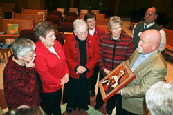 Paul Lunsford, the president of St. Theodore Guérin High School in Noblesville, Ind., in the Lafayette Diocese, right, talks about an icon of St. Theodora Guérin that the school presented to the Sisters of Providence of Saint Mary-of-the-Woods. Shown with Lunsford are, from left, Providence Sister Denise Wilkinson, the general superior of the order, and the general officers, Providence Sisters Paula Damiano, Marie McCarthy, Jane Marie Osterholt and Nancy Reynolds. (Submitted photo)