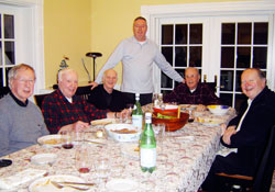 Bishop-designate Christopher J. Coyne, center, poses during a recent dinner at his Westwood, Mass., rectory with Father Leroy Owen, from left, Msgr. Peter Conley, Father John Grimes, Father William Burkhardt and Father John Sullivan. During his time as the pastor of St. Margaret Mary Parish in Westwood, Bishop-designate Coyne fostered priestly fraternity by frequently hosting dinners with fellow priests on Saturday evenings. (Submitted photo)