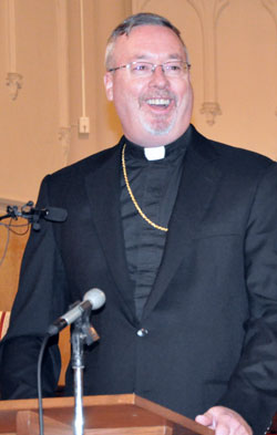 Bishop-designate Christopher J. Coyne smiles during a Jan. 14 press conference at St. John the Evangelist Church in Indianapolis. On that day, Pope Benedict XVI appointed Bishop-designate Coyne as an auxiliary bishop for the Archdiocese of Indianapolis. (Photo by Mary Ann Wyand)