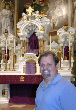 Wanting to honor his wife, Mary, who died in January, Jeff Williamson set out this Lent to attend Mass at 40 churches in 40 days. Here, he poses in front of the sanctuary of Our Lady of the Most Holy Rosary Church in Indianapolis. (Photo by John Shaughnessy)