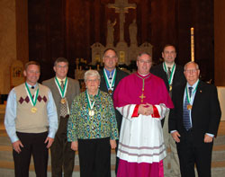 The 2011 St. John Bosco Award winners pose for a photograph with Bishop Christopher J. Coyne, auxiliary bishop and vicar general, during the Catholic Youth Organization awards ceremony on May 3 at SS. Peter and Paul Cathedral in Indianapolis. They are, from left, Larry Leonhardt, Pete Schroeder, Suzie Wells, Mark Meunier, Bishop Coyne, Bob Korson and Don Nester. (Submitted photo)