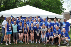 Members of the “Race for Vocations” team pose on May 7 by the team’s tent at Military Park in Indianapolis after completing the OneAmerica 500 Festival Mini-Marathon or the Finish Line 500 Festival 5K. (Submitted photo)