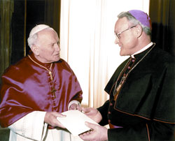 Bishop Gerald A. Gettelfinger speaks with Pope John Paul II during the Evansville bishop’s 1993 ad limina visit to the Vatican. Bishops make an ad limina visit every five years to meet with the pope. Pope John Paul appointed Bishop Gettelfinger, a priest of the Archdiocese of Indianapolis, to lead the Church in southwestern Indiana in 1989. (Submitted photo)