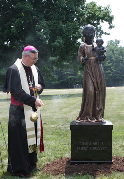 Bishop Christopher J. Coyne incenses the image of Our Lady of Einsiedeln. The statue was dedicated on July 16 at Our Lady of Peace Cemetery in Indianapolis. (Photos by Alea Bowling)