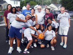 During a season that showed the essence of sports, the players, coaches and key supporters of the kickball team of Holy Angels Parish in Indianapolis pause for a photo that reflects the joy of the game. (Submitted photo)