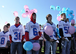 Roncalli High School freshman football team members, from left, Ethan Briggeman, David Schott, Tyler Schoettle, Joe Gervasio and Eli Smith participate in the 40 Days for Life youth rally on Oct. 15 in front of the Planned Parenthood abortion facility in Indianapolis. (Photo by Mary Ann Garber)