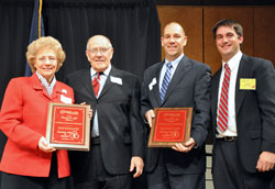 Respect Life Award recipients, from left, Patricia and William Schneider of Christ the King Parish in Indianapolis and their son, State Sen. Scott Schneider (R-Indianapolis), accept their awards from Right to Life of Indianapolis president Marc Tuttle during the Celebrate Life dinner on Sept. 27 at the Indiana Convention Center in Indianapolis. (Photo by Mary Ann Garber)