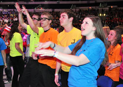Young people enjoy music as they prepare for the Nov. 18 evening session at the National Catholic Youth Conference in Indianapolis. (Photo by Sean Gallagher)