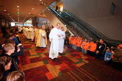 Seminarian Timothy Wyciskalla of the Archdiocese of Indianapolis leads the eucharistic procession through the Indiana Convention Center in Indianapolis during the opening day of the National Catholic Youth Conference on Nov. 17. (Photo by Rich Clark)