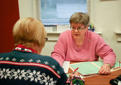 Providence Sister Beth Wright works on Dec. 13 at the St. Ann Clinic in Terre Haute, a ministry that provides free medical, dental, psychological, pharmaceutical and counseling services to people without medical insurance. (Photo courtesy of Sisters of Providence of Saint Mary-of-the-Woods)