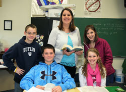 Five teachers from across the archdiocese were recently recognized as winners of the Saint Theodora Excellence in Education Award. Lisa Vogel, above, the eighth-grade teacher at St. Mary School in North Vernon, says her main focus when teaching students is to be a Christian by the love that she shows others. She is pictured with students, seated, from left, Trace Sporleder and Taylor AmRhein. Standing are Kobe Eder, Vogel and Stefani Williams. (Submitted photo)