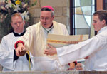 Bishop Coyne consecrating an altar