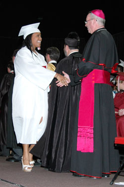 Bishop Christopher J. Coyne congratulates Jasmine Oliver during the 2011 graduation ceremony for Father Thomas Scecina Memorial High School graduates in Indianapolis. (Submitted photo)