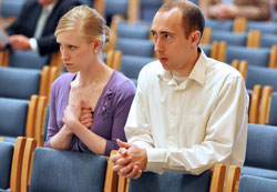 Tom and Caitlin Landrigan, members of Our Lady of the Most Holy Rosary Parish in Indianapolis, kneel in prayer during the annual Miter Society Mass on May 2 at SS. Peter and Paul Cathedral in Indianapolis. The society’s membership is made up of Catholics in central and southern Indiana who have contributed at least $1,500 to the “Christ Our Hope: Compassion in Community” annual appeal. (Photos by Sean Gallagher)
