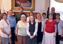 On May 30, the Archdiocese of Indianapolis honored 10 lay Catholics from across central and southern Indiana for completing its lay ministry formation program during a liturgy at the Blessed Sacrament Chapel of SS. Peter and Paul Cathedral in Indianapolis. Posing in the cathedral rectory after the liturgy are, front row from left, Eva Morales, Nora Cummings, Kay Summers, Colleen Velez and Barbara Black and, back row from left, Greg Otolski, Brandon Evans, Marianne Hawkins, Cathy Funkhouser, Bishop Christopher J. Coyne and Kathy Wilt. (Photo by Sean Gallagher)