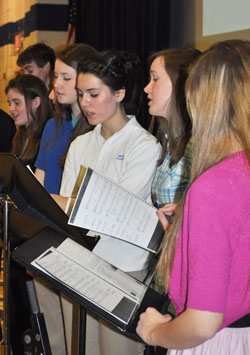 From left, Katie Gozdecki, Nicole Lehrman, Madeleine Jurkiewicz, and Elizabeth Bain sing at Bishop Chatard High School in Indianapolis during one of the monthly all-school liturgies in the 2011-12 school last year. All four girls are part of the liturgical musicians group, which leads the student body in singing at every Mass. (Submitted photo)