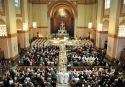 Bishop Christopher J. Coyne, apostolic administrator, and priests ministering in central and southern Indiana process into SS. Peter and Paul Cathedral in Indianapolis on April 3 at the start of the annual archdiocesan chrism Mass. The upcoming Year of Faith will be a time for Catholics across the archdiocese to grow in their faith so that they can share it better with others. (File photo by Sean Gallagher)