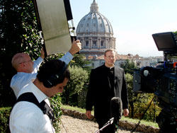 Father Robert Barron stands on a hilltop overlooking St. Peter’s Basilica in Rome during the shooting of his 10-part documentary series “Catholicism.” A priest of the Archdiocese of Chicago, Father Barron is the founder and president of Word on Fire Ministries and rector of the University of St. Mary of the Lake Mundelein Seminary near Chicago. During a recent visit to Indianapolis, Father Barron reflected on the meaning and continued relevance of the Second Vatican Council. The 50th anniversary of the opening of the council, which took place in St. Peter’s Basilca, occurred on Oct. 11. (Photo courtesy Word on Fire Ministries)