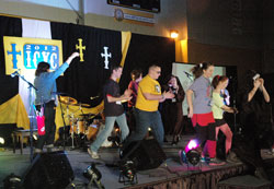 The 2012 Indianapolis Catholic Youth Conference begins with singing, dancing and cheering on Nov. 3 at Marian University in Indianapolis. Nearly 700 youths from the Archdiocese of Indianapolis and the Diocese of Lafayette, Ind., attended the event. (Photo by John Shaughnessy)