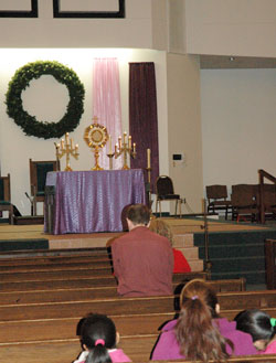 Eucharistic adoration was part of a Nov. 30 program at Our Lady of the Greenwood Church in Greenwood in which prayers were offered for Archbishop Joseph W. Tobin, the new archbishop of the archdiocese. (Photo by John Shaughnessy)