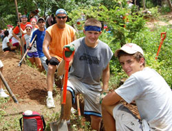 Volunteers from Our Lady of Providence Jr./Sr. High School in Clarksville take a break from digging a trench to bring clean running water to outlying villages in Nicaragua in the summer of 2012. From left, senior Lloyd Lashley, junior Abby Spitznagel, junior Megan Gilland, 2012 graduate Elliott Happel, Spanish teacher Alan Mathews, junior Trey Embry and junior Austin Happel. (Submitted photo)